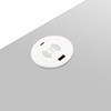 Plaque de charge sans fil circulaire blanche avec un port de charge USB filaire sur chaque bord ; logo sans fil blanc au centre.  