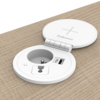 Prise d'alimentation circulaire avec une prise 230V, un port de charge USB-C et un port de charge USB-A, avec un couvercle incluant la charge sans fil.  
