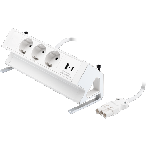 Rechteckige weiße Einheit mit drei 230V-Anschlüssen und zwei USB-Anschlüssen. Die Einheit steht in einem 45°-Winkel und wird mit einer Klemme unter dem Schreibtisch befestigt.
