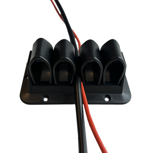Four arch-shaped holes, fixed on a black plastic frame, with blue and white cables running through them and screw holes around the edges.  