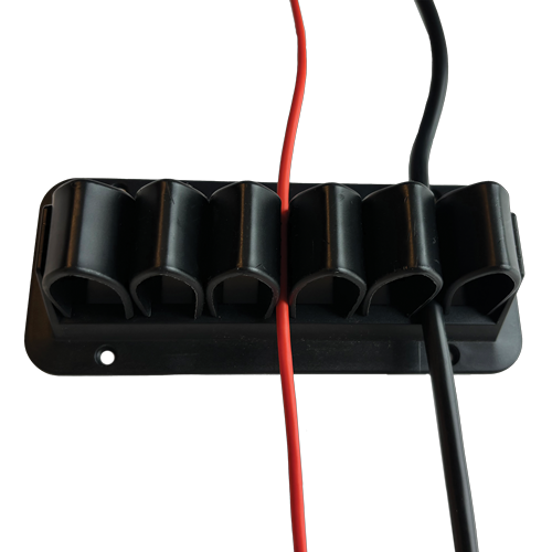 Six arch-shaped holes, fixed on a black plastic frame, with blue and white cables running through them and screw holes around the edges.  