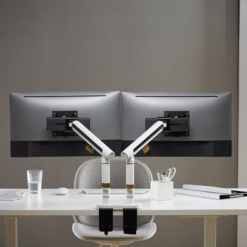 White table mount supports two vertical poles, which hinge halfway up and support two separate brackets. 